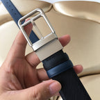 Dark blue belt with silver rectangular buckle and leather keeper