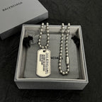Silver-tone bead necklace with dog tag pendant in presentation box