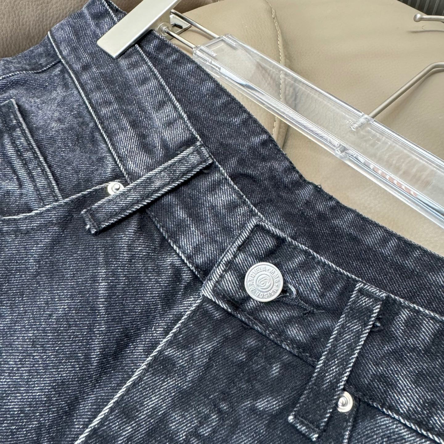 Maison Margiela denim jeans front pocket and button details with distressing