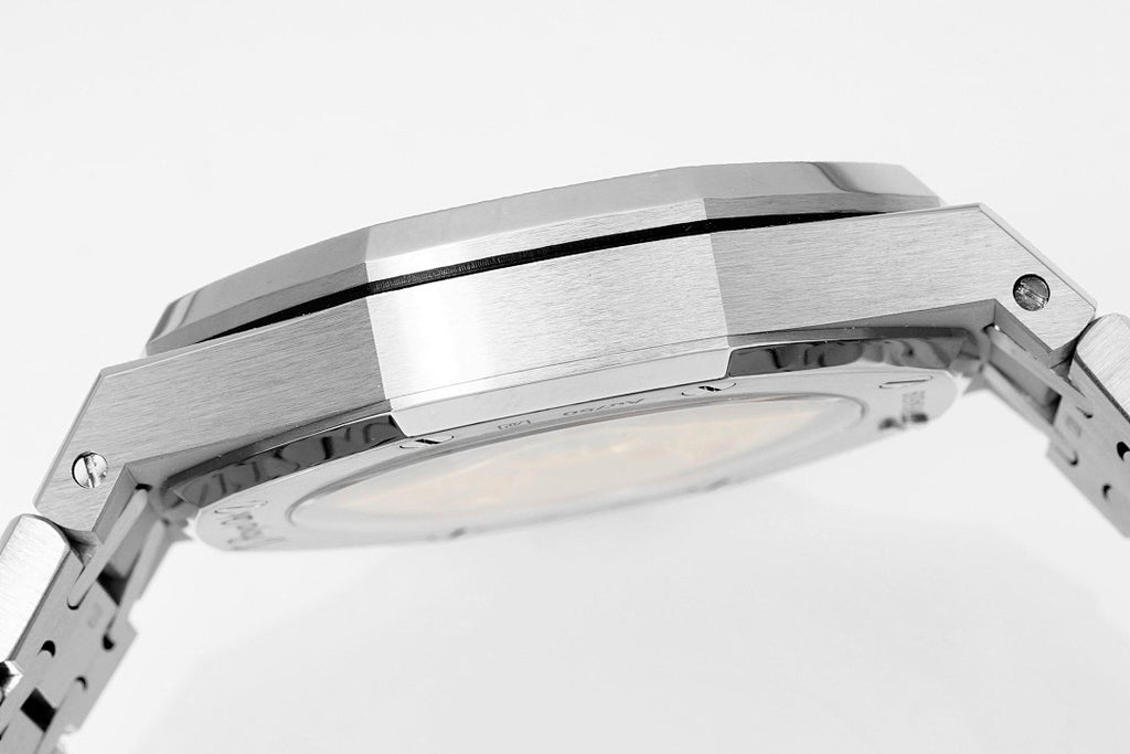 Audemars Piguet Royal Oak watch case side with brushed steel finish and screw details.
