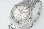 Audemars Piguet watch angled view with white dial, date window, and steel bracelet