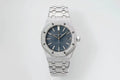 Audemars Piguet watch with blue dial, silver link bracelet, octagonal bezel and crown