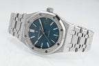 Audemars Piguet watch with textured blue dial, silver links, and crown at 3 o'clock