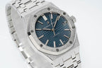 Audemars Piguet watch three-quarter view with blue dial, silver bezel, and bracelet links