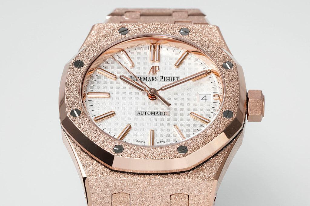 Rose gold-toned bezel and white patterned dial automatic wristwatch face