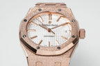 Rose gold-toned bezel and white patterned dial automatic wristwatch face