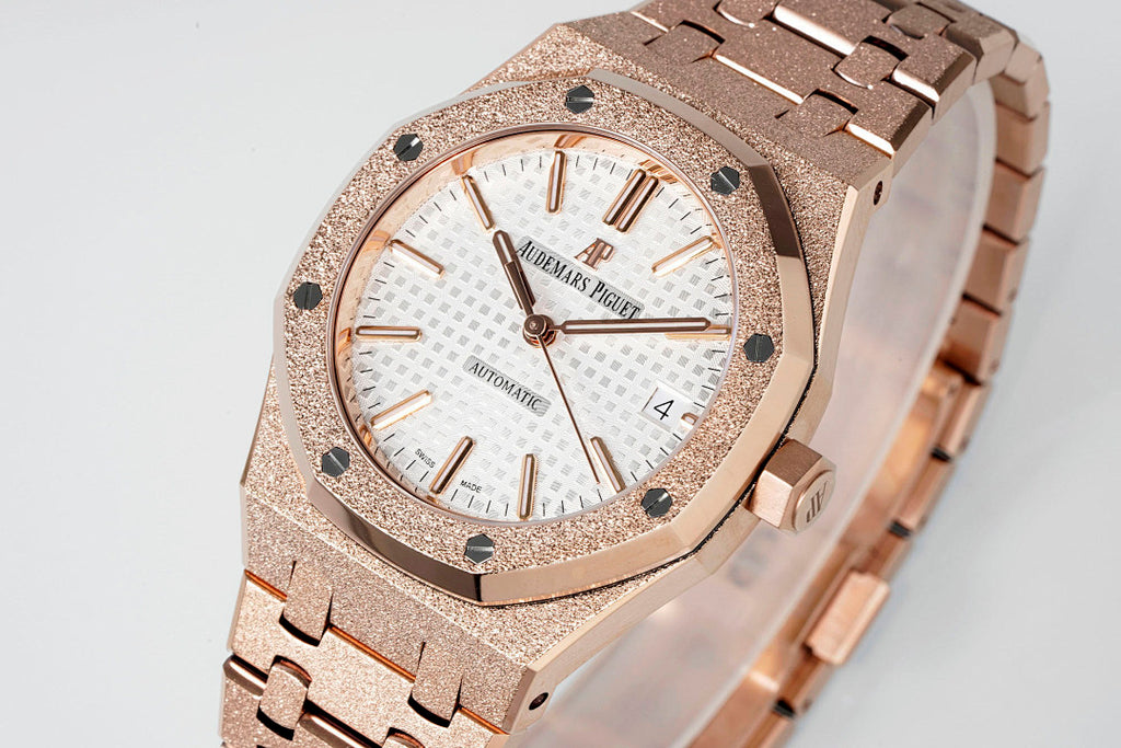 Rose gold-toned automatic wristwatch with white dial and Arabic numerals