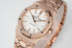 Rose gold-toned automatic wristwatch with white dial and Arabic numerals