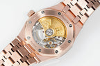 Audemars Piguet rose gold-tone watch case open view with gold-toned movement