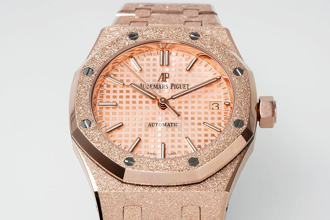 Audemars Piguet rose gold-tone sports watch with textured case and peach dial