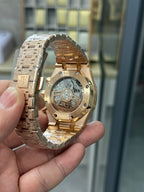Audemars Piguet watch rose gold case back with visible movement through window