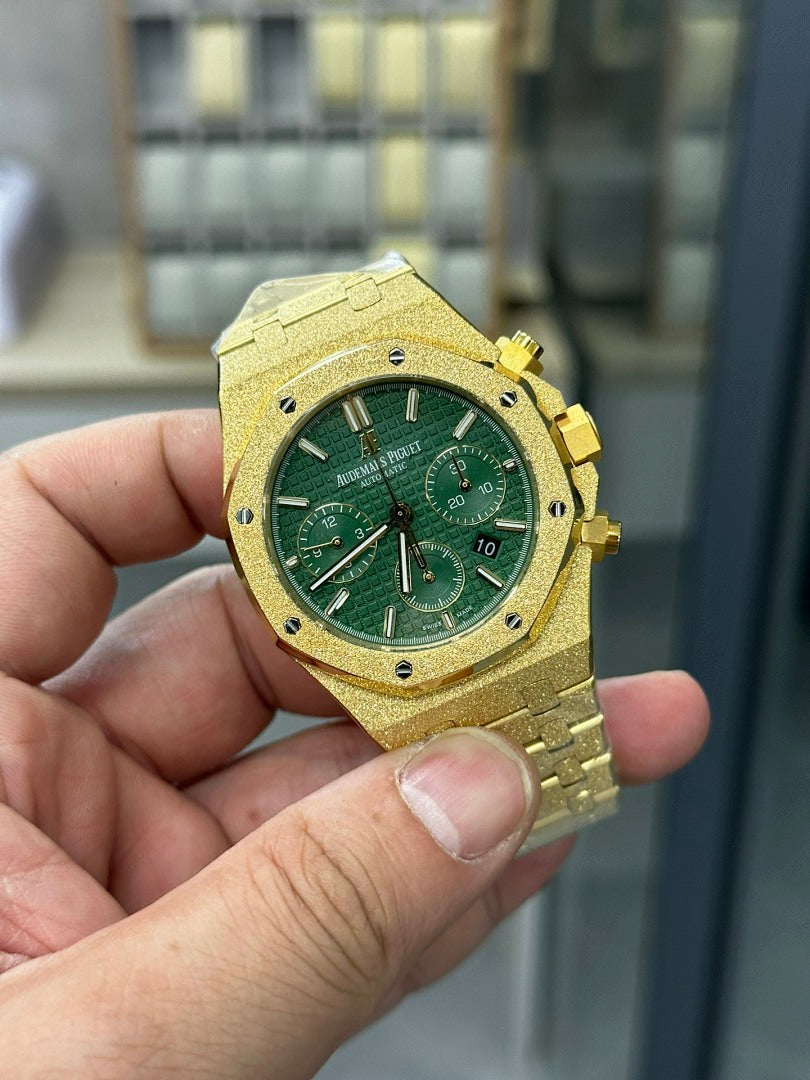 Audemars Piguet watch with gold case and green dial, hour and minute hands, subdials