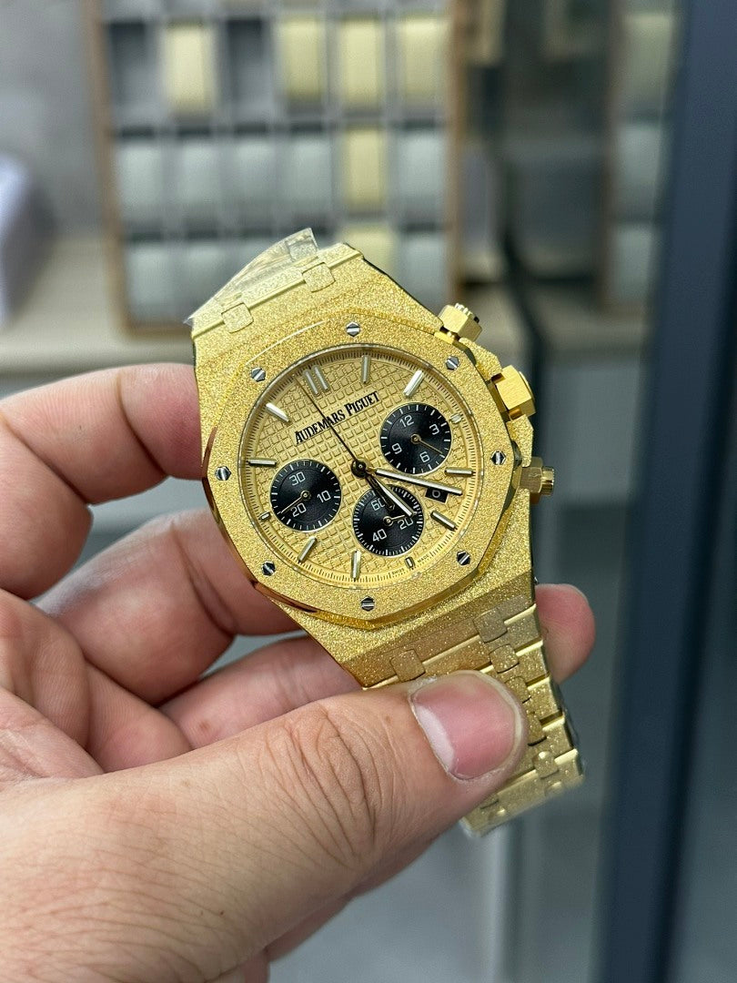 Audemars Piguet watch, angled view of gold case, black subdials, three registers