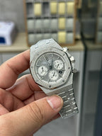 Audemars Piguet watch with gray textured case, chronograph subdials, and bracelet