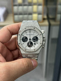 Steel chronograph watch with gray dial, three black subdials, crown and pushers