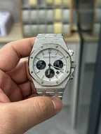 Steel chronograph watch with gray dial, three black subdials, crown and pushers