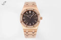 Rose gold wristwatch with black dial, diamond bezel, and link bracelet.