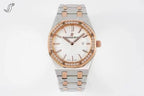 Two-tone wristwatch with white dial, diamond bezel, and link bracelet with rose gold accents.