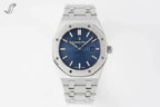Audemars Piguet watch with blue dial, diamond-set bezel, and stainless bracelet