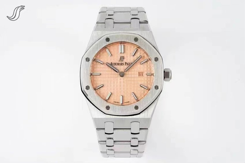Audemars Piguet watch with peach dial, diamond-set bezel, and stainless bracelet