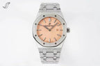 Audemars Piguet watch with peach dial, diamond-set bezel, and stainless bracelet