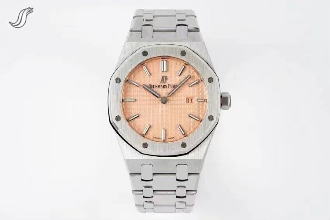 Audemars Piguet watch with peach dial, diamond-set bezel, and stainless bracelet