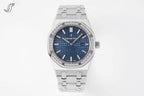 Audemars Piguet watch with deep blue dial, diamond-set bezel, and stainless bracelet