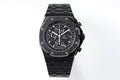 Audemars Piguet black chronograph watch with linked bracelet and dark dial