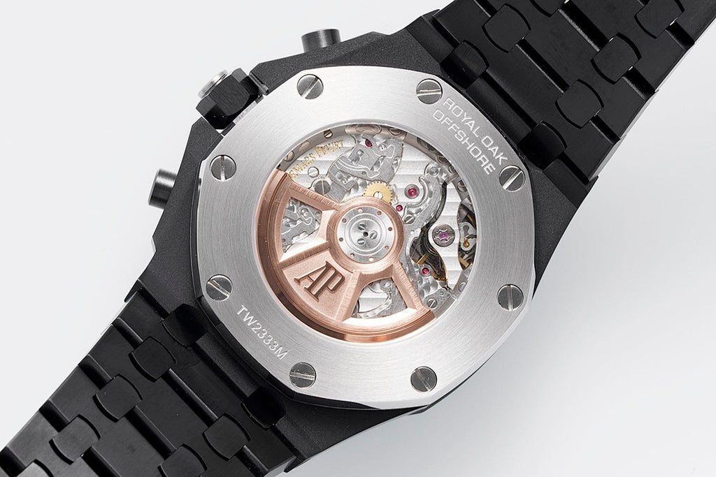 Audemars Piguet watch case with exposed movement through sapphire window and black strap