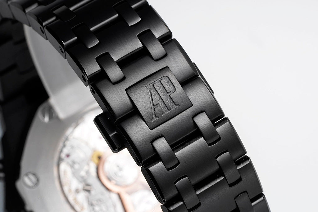 Audemars Piguet black link bracelet with engraved AP logo on clasp