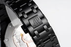 Audemars Piguet black link bracelet with engraved AP logo on clasp
