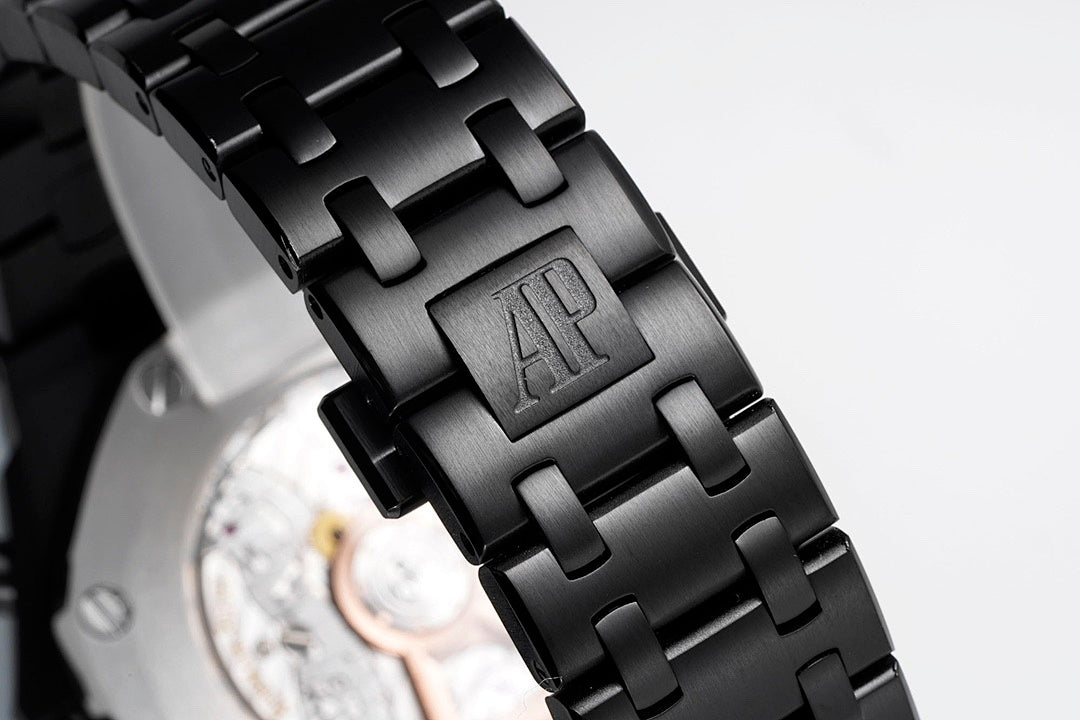 Audemars Piguet black link bracelet with engraved AP logo on clasp