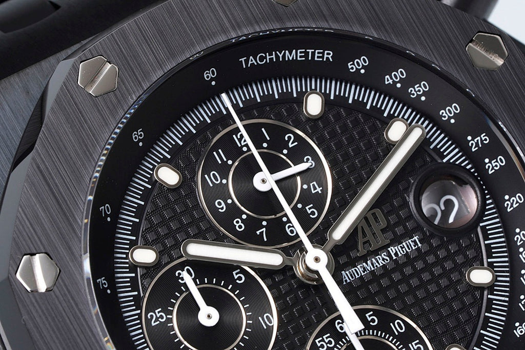 Audemars Piguet tachymeter bezel close-up with black dial and subdial counters