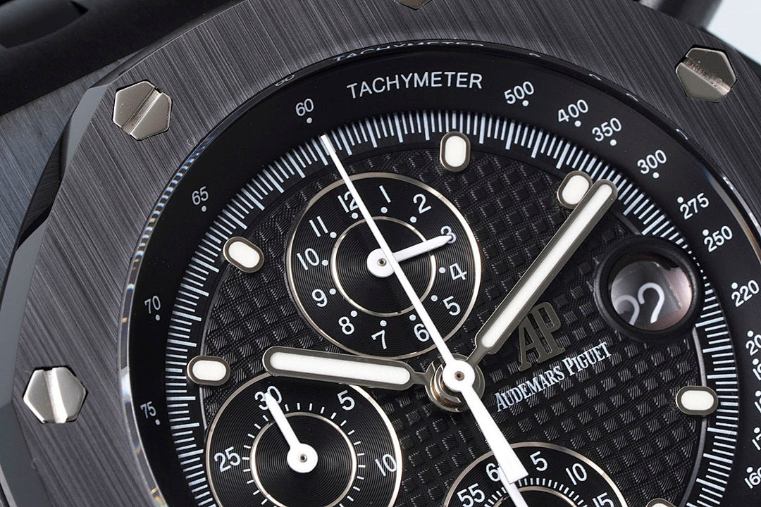 Audemars Piguet tachymeter bezel close-up with black dial and subdial counters