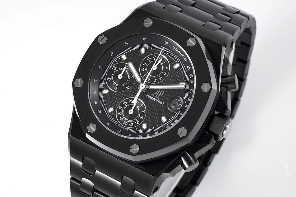 Audemars Piguet black chronograph watch with textured dial and metal bezel