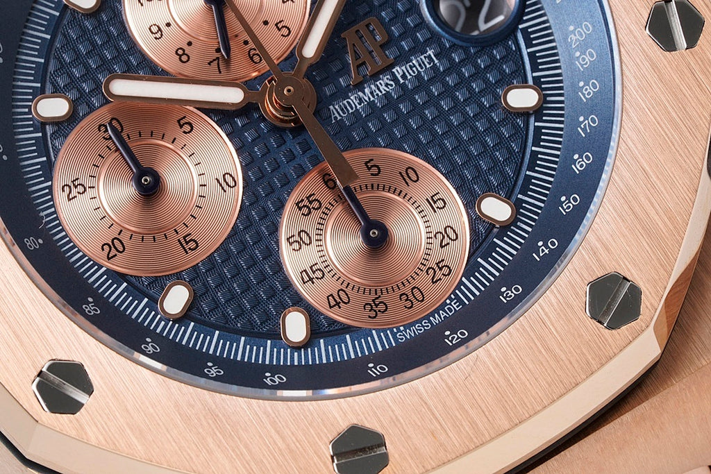 Audemars Piguet chronograph dial close-up with blue face, copper subdials, raised indexes