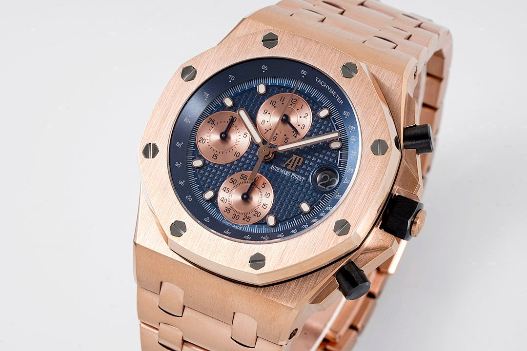 Audemars Piguet rose gold wristwatch with blue dial, three copper subdials, linked bracelet