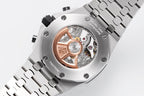 Audemars Piguet chronograph watch with exposed movement in silver case and black bezel.