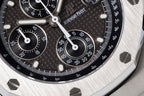 Audemars Piguet chronograph dial with black textured face, white markers, and subdials.