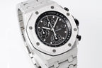 Audemars Piguet chronograph watch with black dial, tachymeter bezel, and silver case.