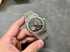 Audemars Piguet Royal Oak watch with silver bracelet and skeleton dial, green emblem