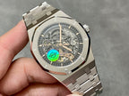Audemars Piguet Royal Oak watch dial close-up, skeleton hands and green emblem