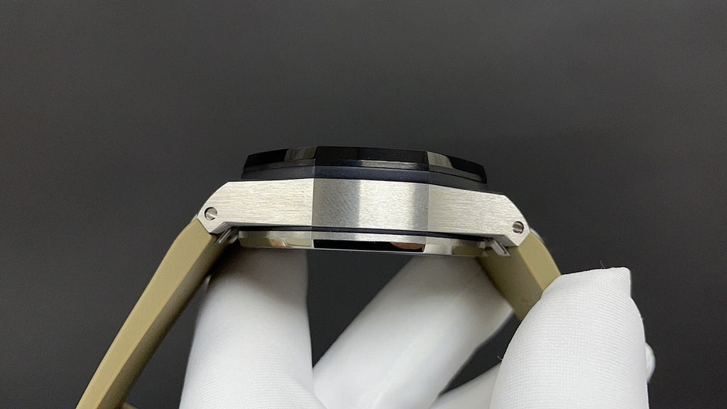 Luxury watch case top with brushed metal bezel and crown guards