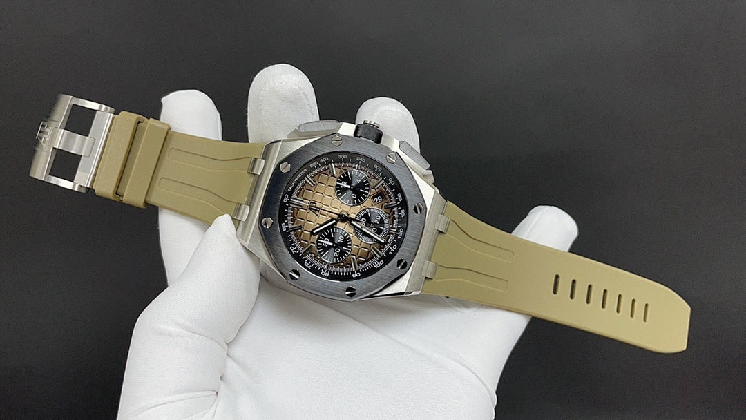 Luxury sports watch on light khaki strap, angled dial and silver case