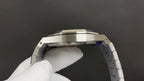 Luxury skeleton wristwatch, silver steel case top view with faceted bezel edges