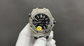 Stainless steel wristwatch with black dial, luminous markers, and three-hand layout.