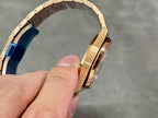 Rose gold watch side profile with blue protective insert on bracelet clasp area