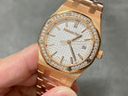 Rose gold Audemars Piguet watch with diamond bezel and textured white dial