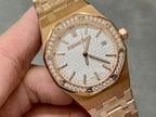 Rose gold watch face with diamond bezel, textured dial, and baton hour markers