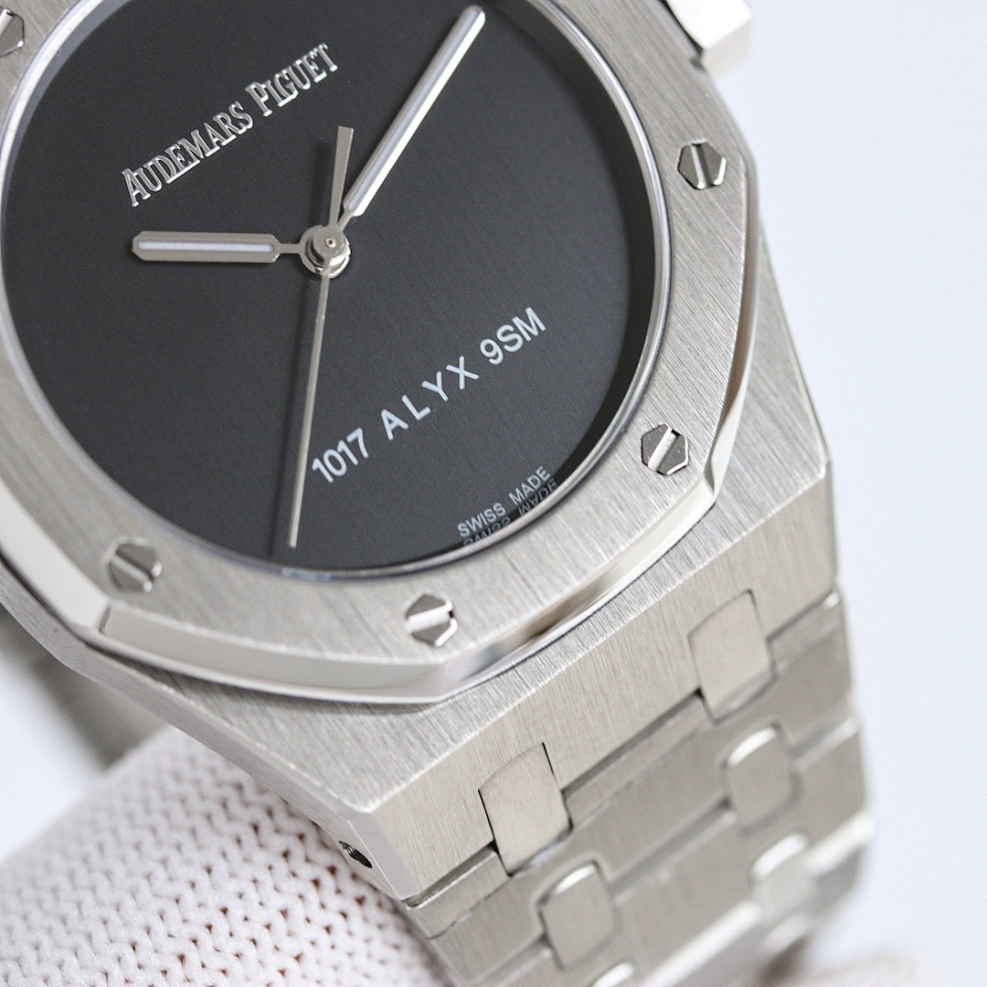 Audemars Piguet watch close-up with black dial, slim baton hands, stainless case